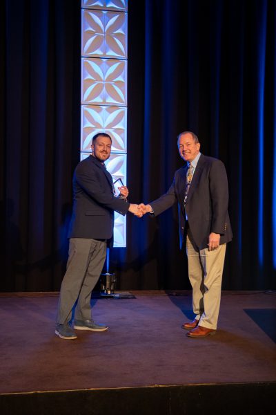 2019 CEC Innovation Award -- Matt Bainbridge accepts the award from Paul Tomiczek III, Chief Technology Officer
