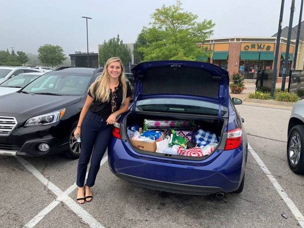 Capria Hall of CEC Columbus dropping off donations to the I Support the Girls organization
