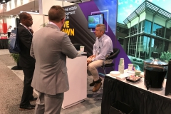Quatchak mans the CEC booth at RECon, the world's largest global gathering of retail real estate professionals, in 2019.